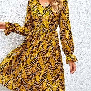 Never worn, yellow and black printed Midi dress